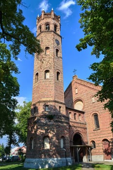 The tower of the historic, Gothic red brick church in the city of Skwierzyna in Poland