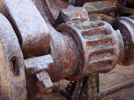 rusted cogs and gears on an old broken industrial machine