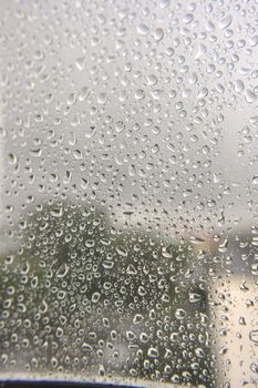 Drops of rain on the window, shallow dof