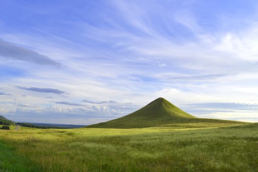 summer landscape with mountain and blue sky with clouds