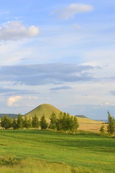 summer landscape with mountain and blue sky with clouds