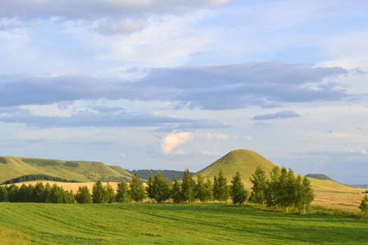 summer landscape with mountain and blue sky with clouds