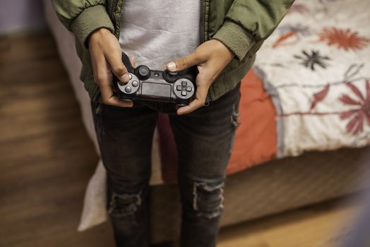 Cropped shot of teenager using remote control