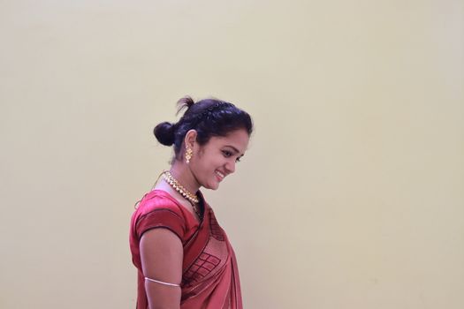 A model woman in a sari dressed in her customs and religion on white background