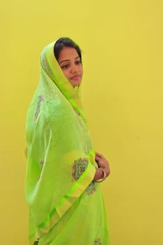 indoors portrait of young model at home with new saree design and pattern