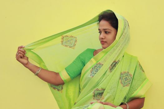 indoors portrait of young fashion model in new saree design , pattern and border