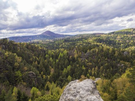 view from sandstone pillar on Luzicke hory mountain panorama with dramatic clouds and forests