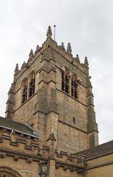 the tower of medieval bradford cathedral in west yorkshire with clock and windows