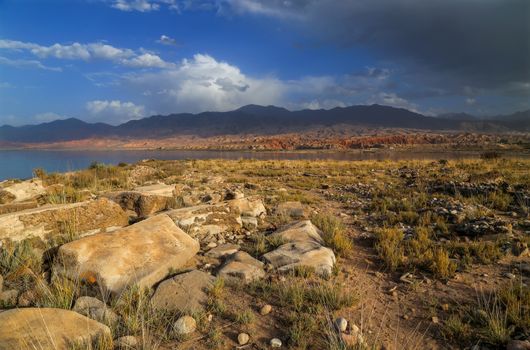 Issyk kul lake with mountains on background in Kyrgyzstan