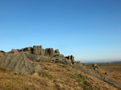 panoramic view of a large rugged gritstone outcrop at the bridestones a large rock formation in west yorkshire near todmorden