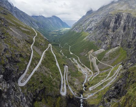 Trollstigen or Trolls Path Trollstigveien famous serpentine mountain road panorama. Viewed from viewpoint in pass on national scenic route Geiranger Trollstigen More og Romsdal county in Norway