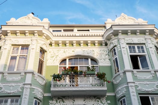 balcony on the old facade with stucco close-up