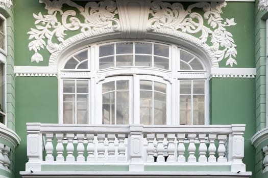 balcony on the old facade with stucco close up