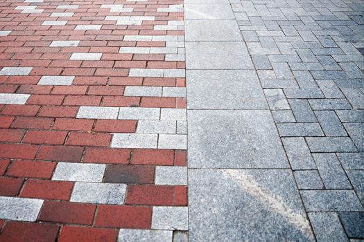 red and gray paving slabs in perspective.