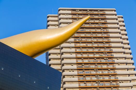 Tokyo. Japan: Asahi Beer buildings. Sunny day. Blue sky. Asahi Breweries headquarters building with the Asahi Flame