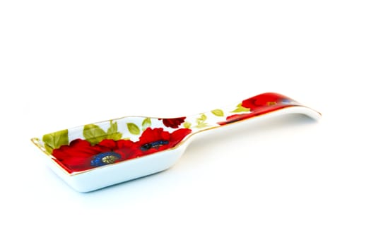 ceramic stand for spoons on a white background