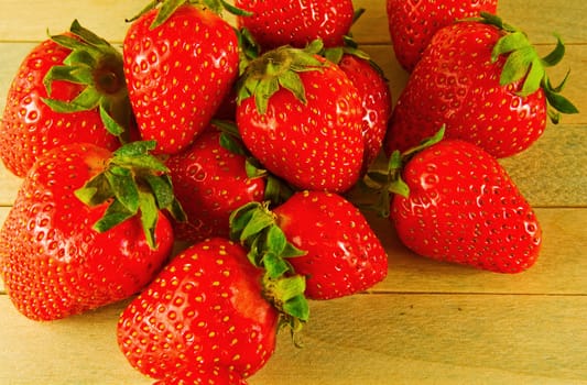 Ripe strawberries on a wooden table

