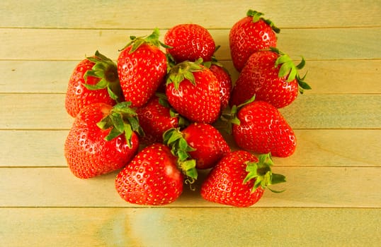 Fresh kluyuniki harvest on a wooden surface

