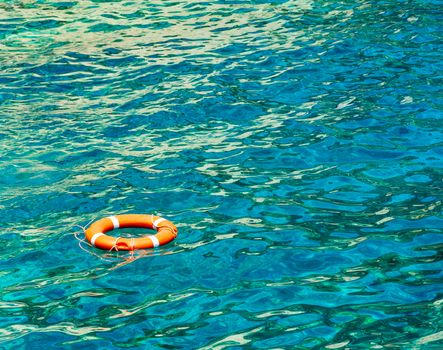 Red life buoy with a white cross strips

