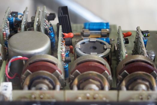 a selective focus close up of old electronic components on circuit boards