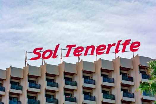 Red sign on the roof of the hotel Sol Tenerife