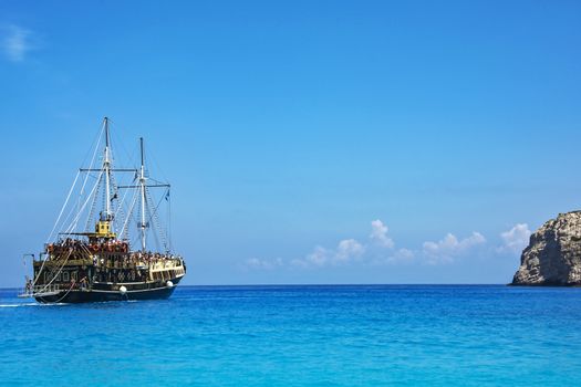 Zakynthos Island, Greece - 09/06/2016: Tourists on a seagoing vessel, stylized old ship sailing on the sea