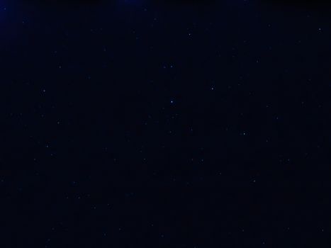 Liguria, Italy - 07/22/2020: Beautiful photography of the moonlight in the different phases with different colours. Black sky and little stars in the background.