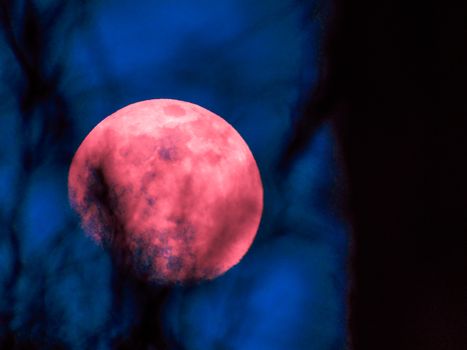 Liguria, Italy - 07/22/2020: Beautiful photography of the moonlight in the different phases with different colours. Black sky and little stars in the background.