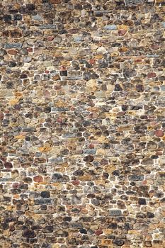 Old large weathered distressed Norman medieval stone brick wall background stock photo