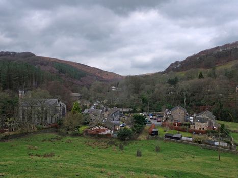 the village of cragg vale in calderdale west yorkshire showing the church and houses between high pennine hills