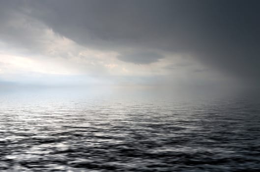 morning seascape with dramatic dark clouds over the ocean