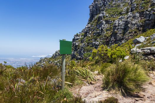 Table Mountain National Park empty green road information board in Cape Town, South Africa.