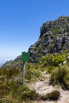 Table Mountain National Park empty green road information board in Cape Town, South Africa.