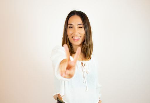 Beautiful young woman in white shirt smiling