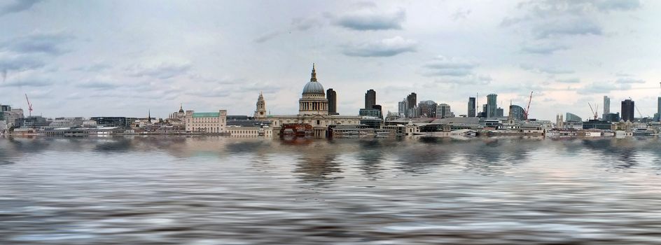 manipulated conceptual image of the city of london with buildings flooded due to global warming and rising sea levels and gulls