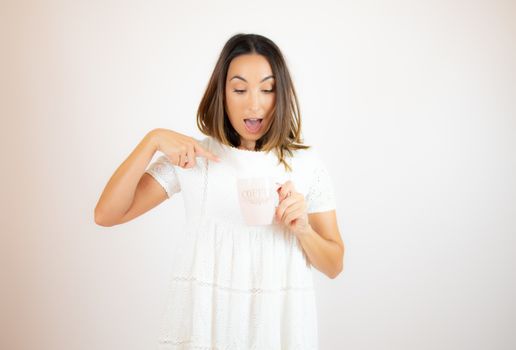 Beautiful young woman with a cup of coffee