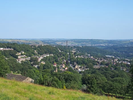 a view of the town of halifax from high west yorkshire countryside surrounded by trees fields and nearby villages