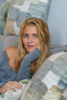 A gorgeous blonde model enjoys a day at home before work