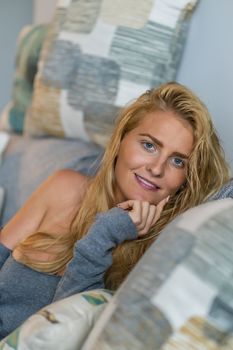 A gorgeous blonde model enjoys a day at home before work