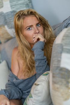 A gorgeous blonde model enjoys a day at home before work