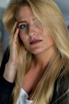 A gorgeous blonde model enjoys a day at home before work