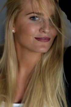 A gorgeous blonde model enjoys a day at home before work