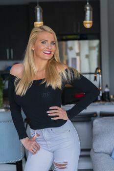A gorgeous blonde model enjoys a day at home before work