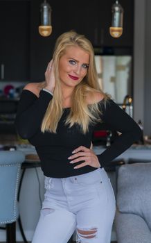 A gorgeous blonde model enjoys a day at home before work