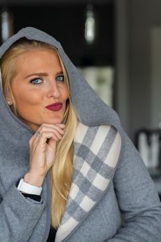A gorgeous blonde model enjoys a day at home before work