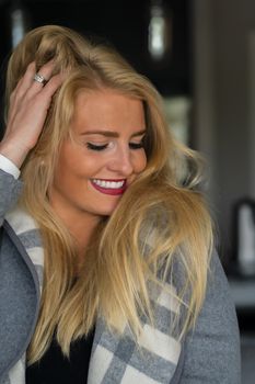 A gorgeous blonde model enjoys a day at home before work