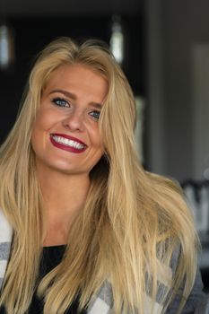 A gorgeous blonde model enjoys a day at home before work