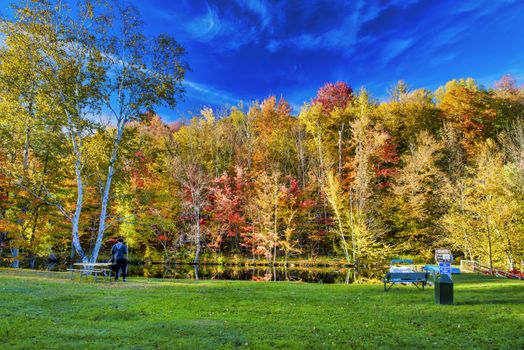 Amazing foliage reflections on a lake. Autumn in New England, USA.