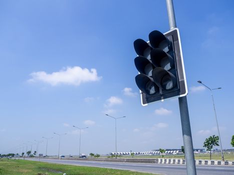 the traffic lights against a vibrant blue sky