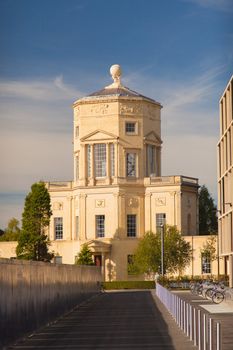 The Radcliffe Observatory in Oxford UK . High quality photo Cream coloured building in afternoon warm sun against a blue sky with clouds